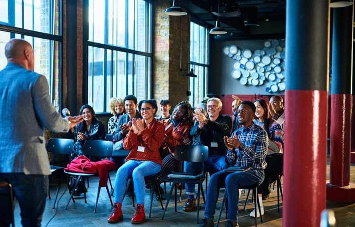 Group of business professionals attending an in-person event.