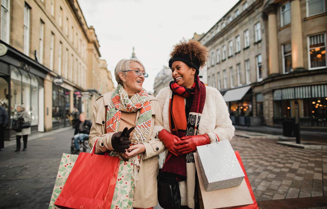 Two women shopping during the holidays.