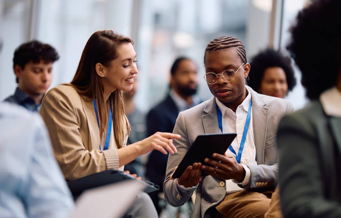 Two business professionals attending a conference.