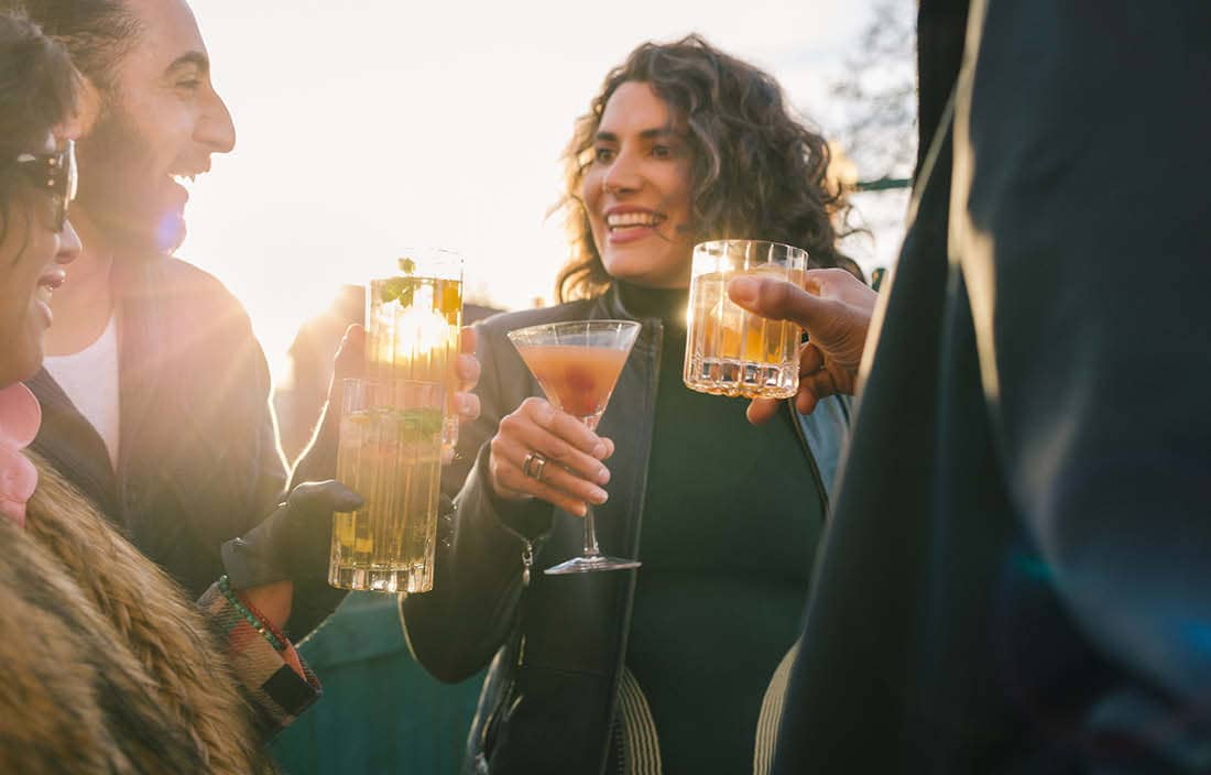 Business professionals celebrating the new year with cocktails.