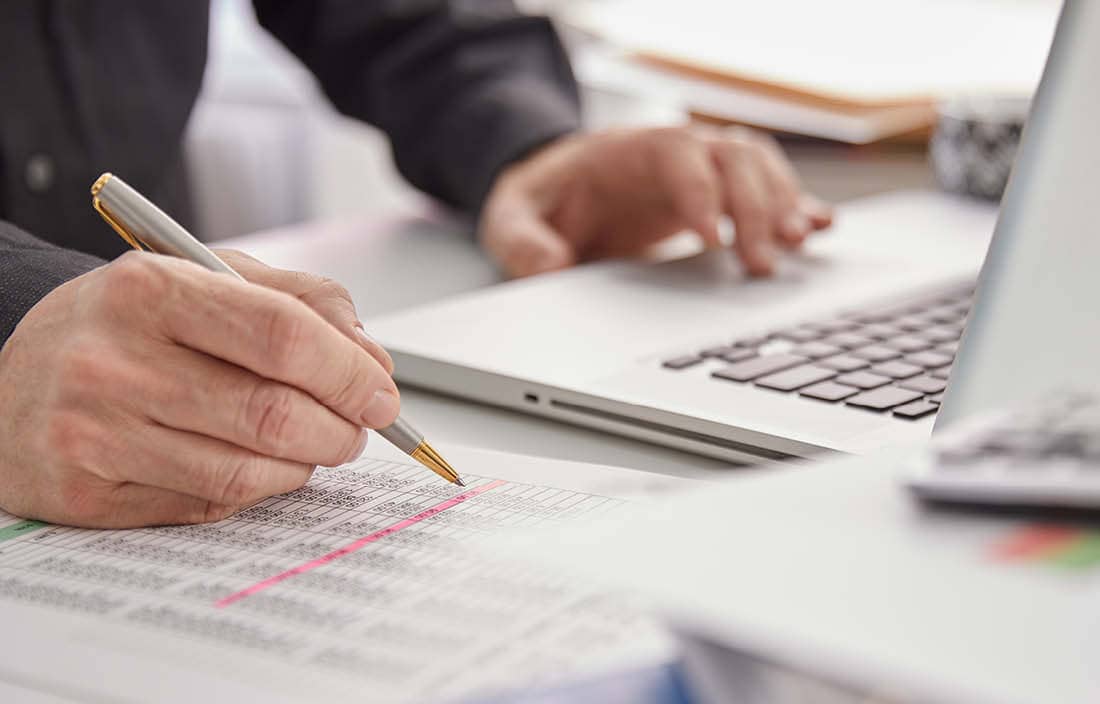 Government professional referring to their notes.