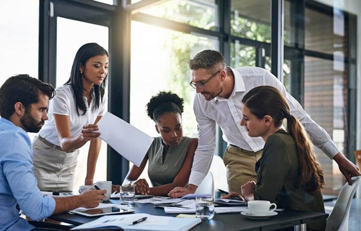 Group of business professionals discussing international tax.