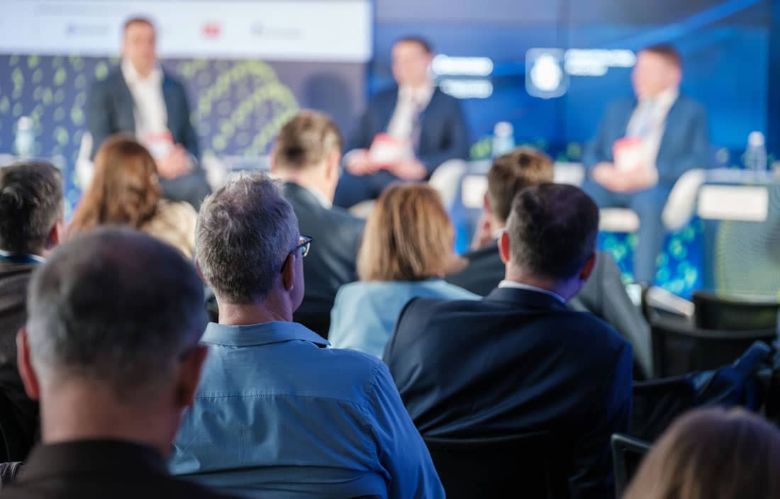 Audience members gathered at a conference.