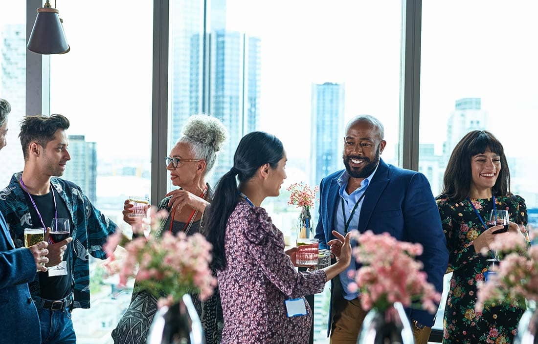 Group of coworkers mingling at work.