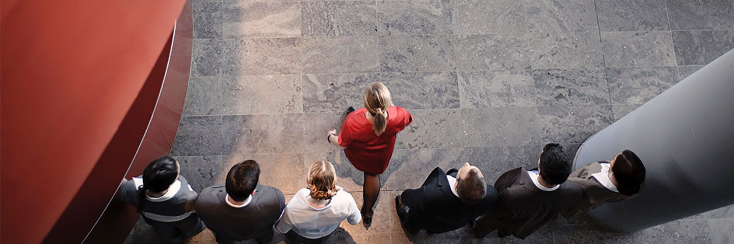 Top down view of business professionals walking together.