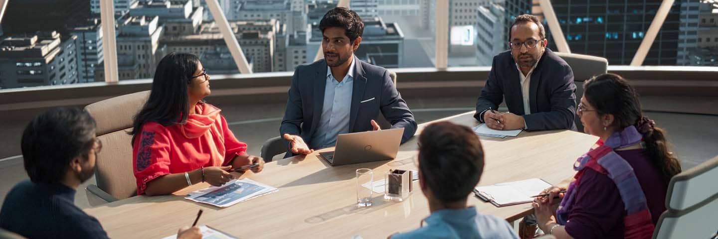 Business professionals in a modern conference room.