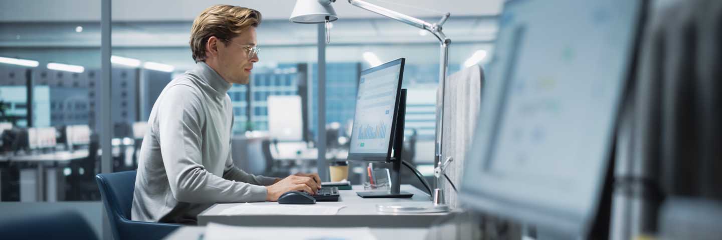 Financial analyst working at their desk.