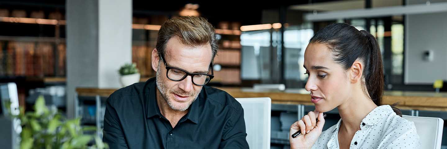 Two financial advisors talking.