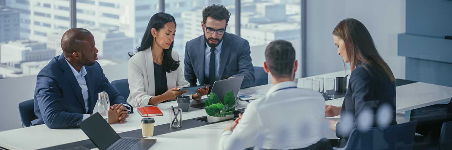 Business professionals meeting in a conference room.