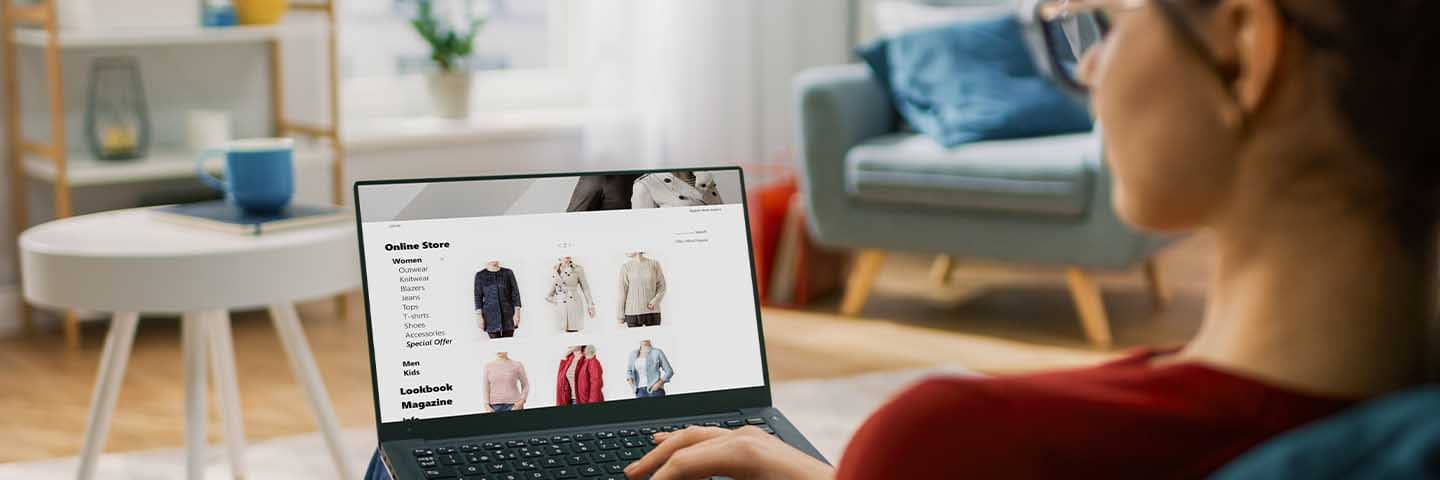Person shopping for clothes on their laptop.