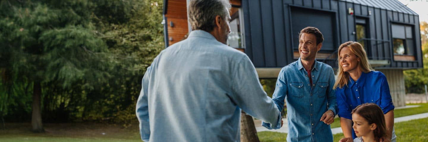 Wealthy family meeting with their financial advisor.