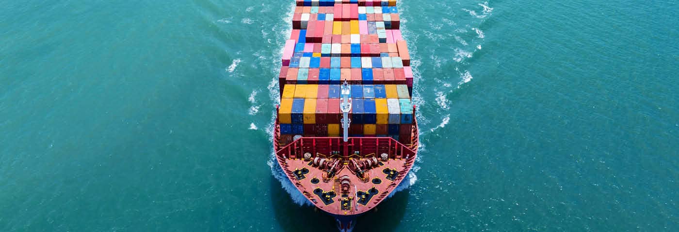 Cargo ship sailing through the ocean.
