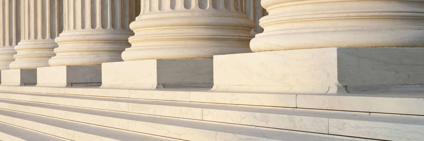 Close-up of government building pillars.