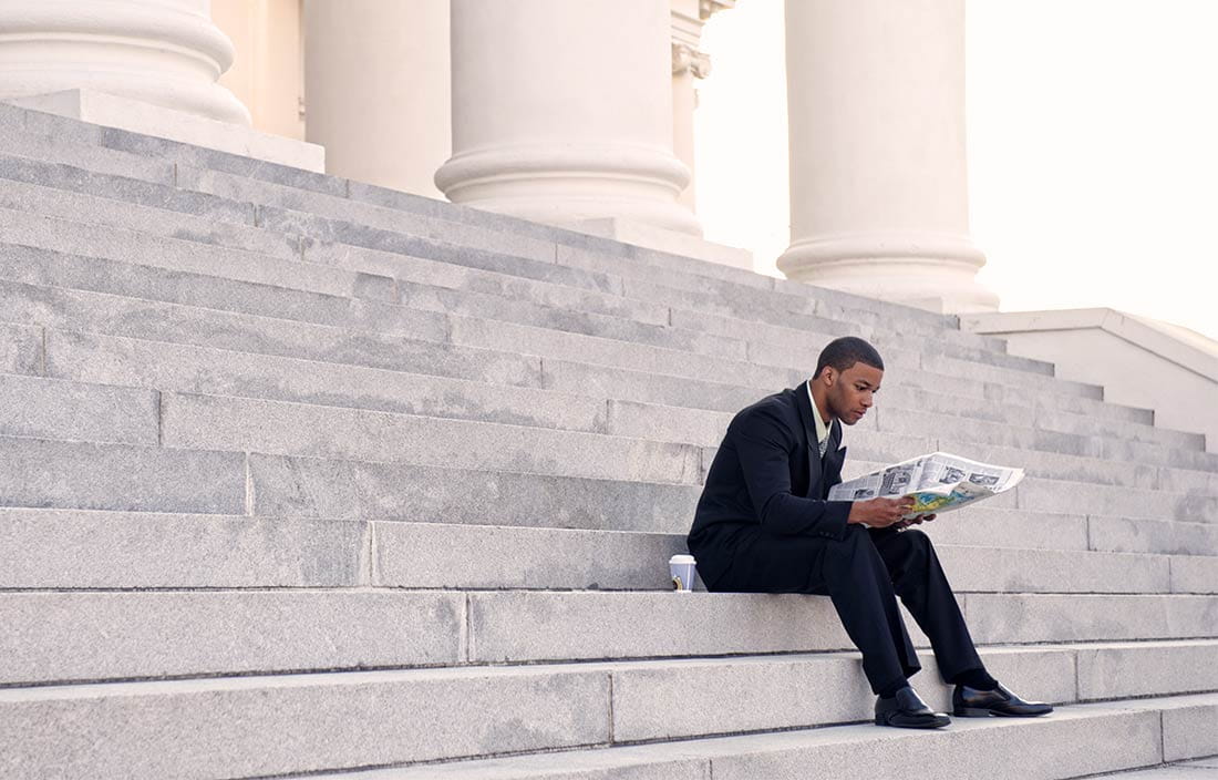 Man reading a newspaper.