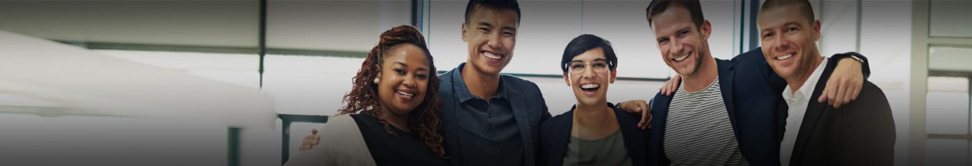 Group of cybersecurity professionals laughing and smiling.