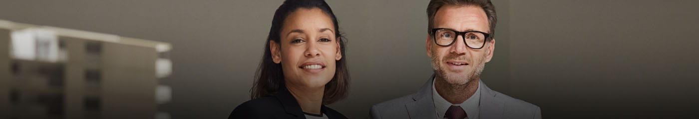 Two business professionals smiling together.