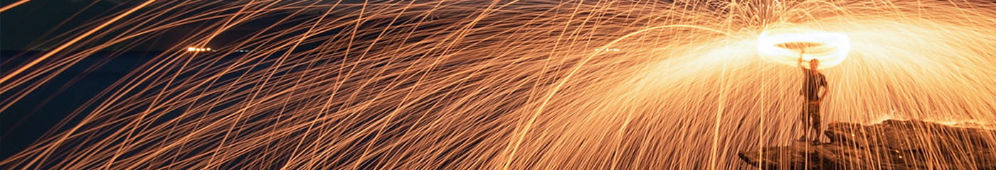 A man celebrating with fireworks.
