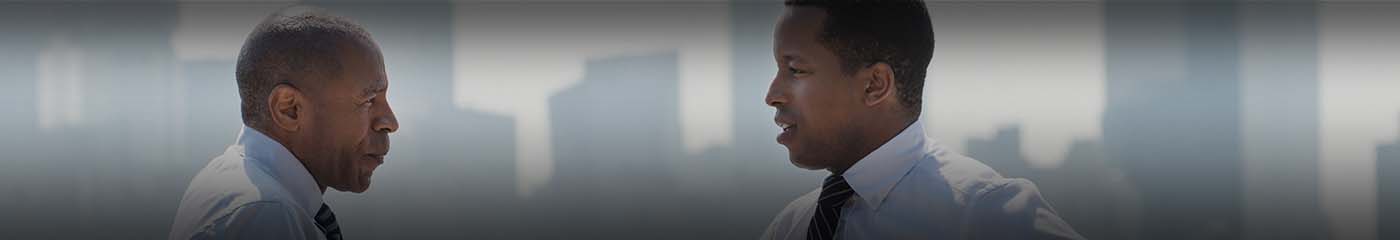 View of two business professionals discussing with one another.