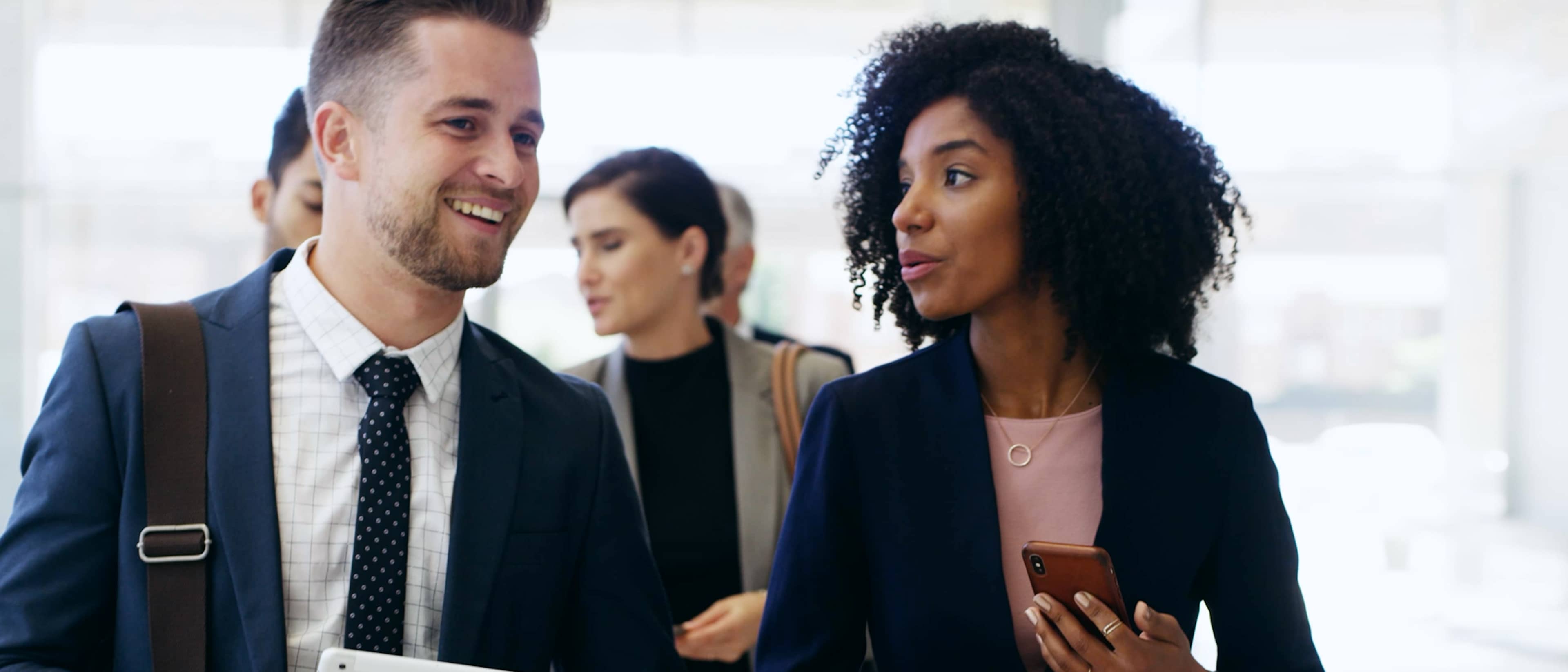Business professionals talking to each other.