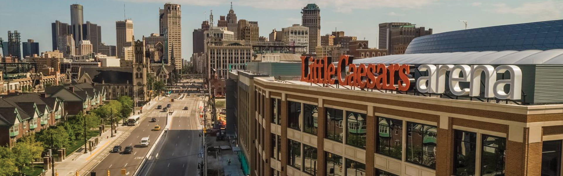 Little Caesars Arena and view of Detroit skyline.