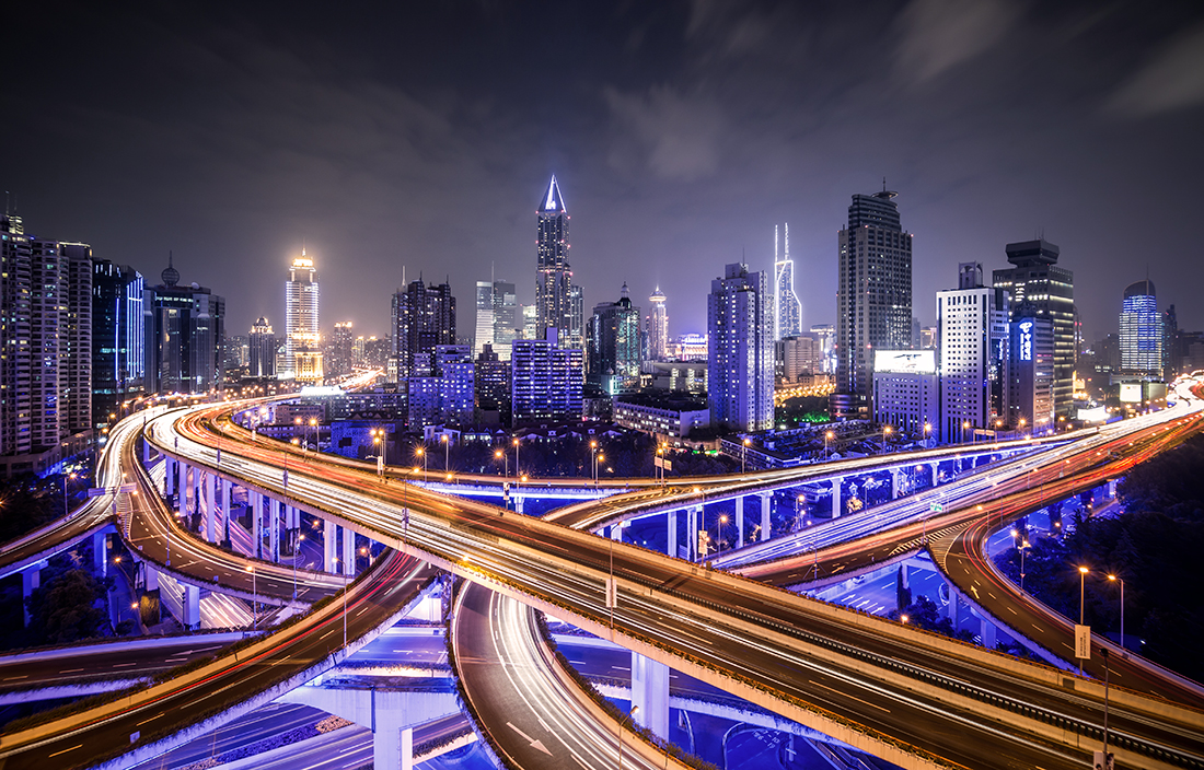 Busy streets in a city at night.