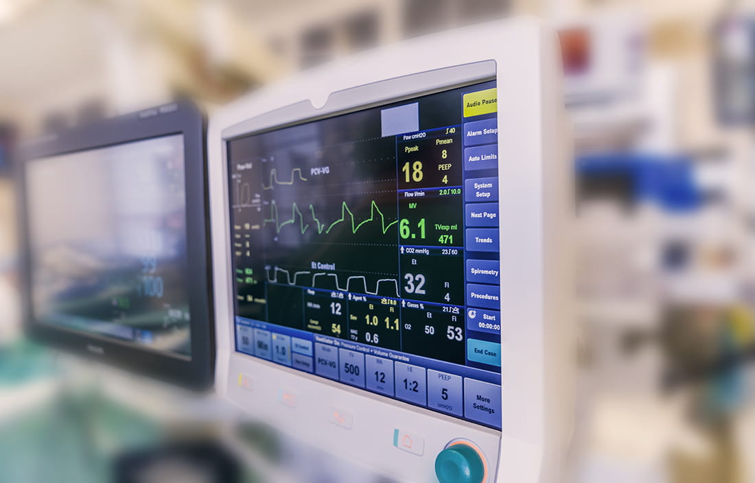 Image of patient diagnostic equipment in a hospital room.