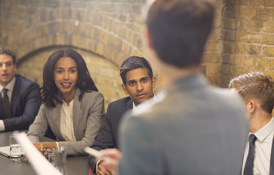 Image of diverse business executives in a board meeting.