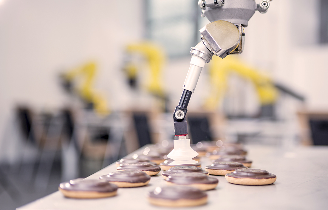 Robotic arm picking up a cookie