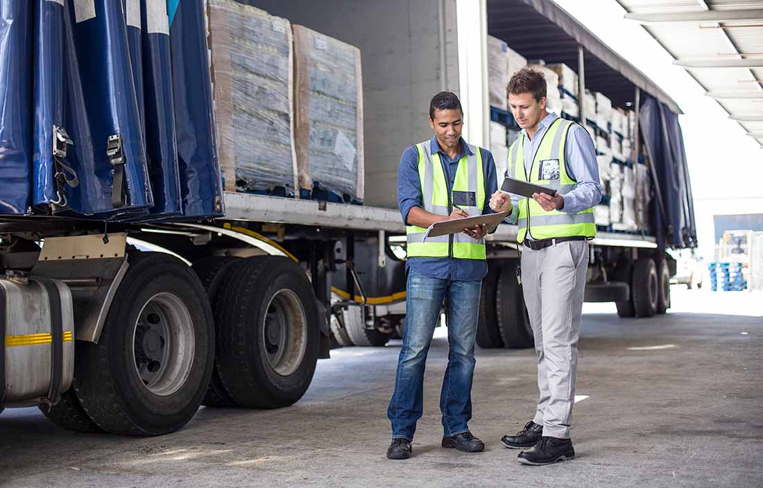 Two shipping and receiving professionals discussing the ELD mandate.