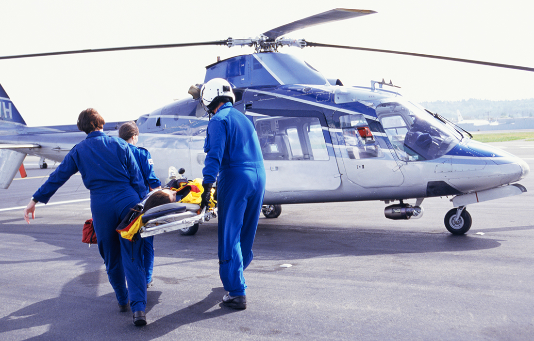Photo of medical personnel performing an emergency medical airlift. 