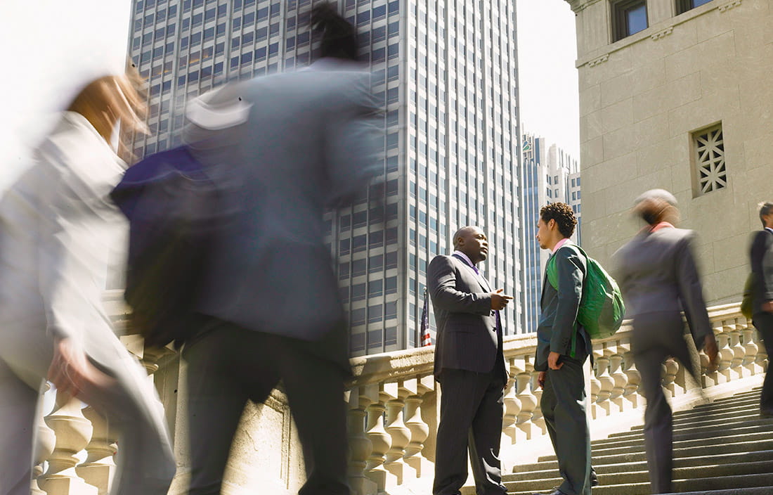 Image of people walking up steps. 