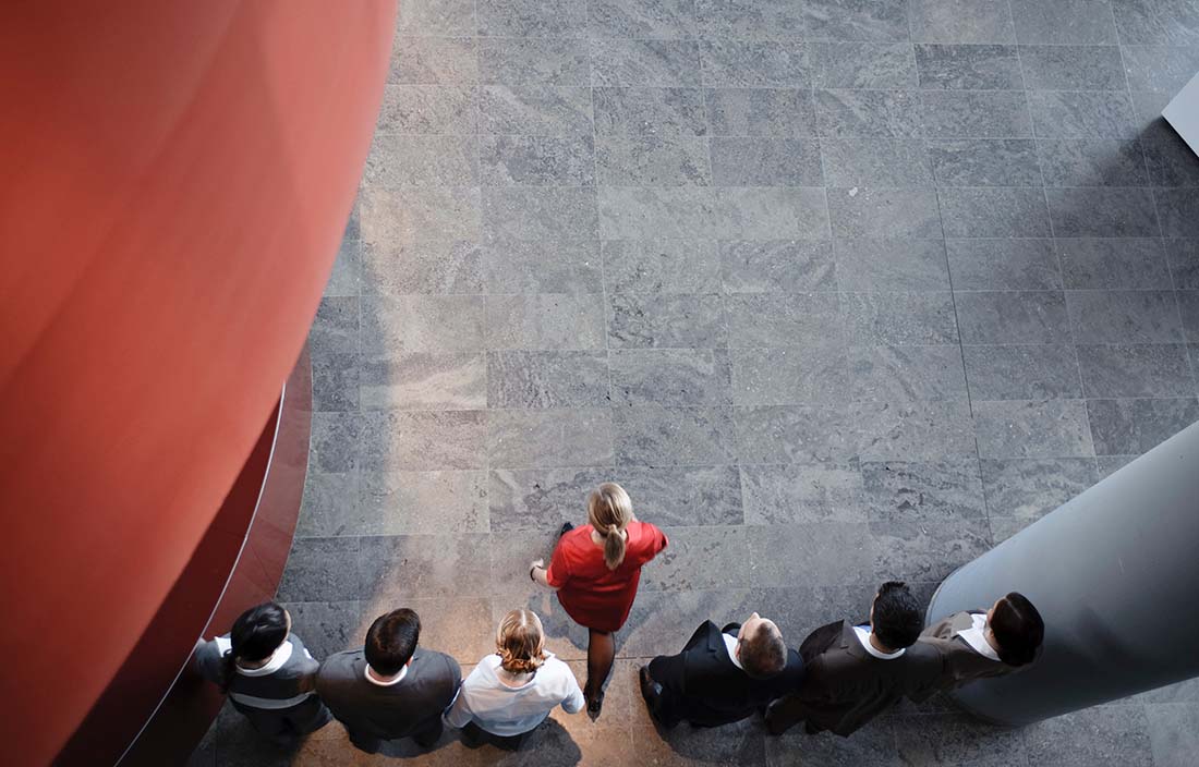 Image of people walking in office building