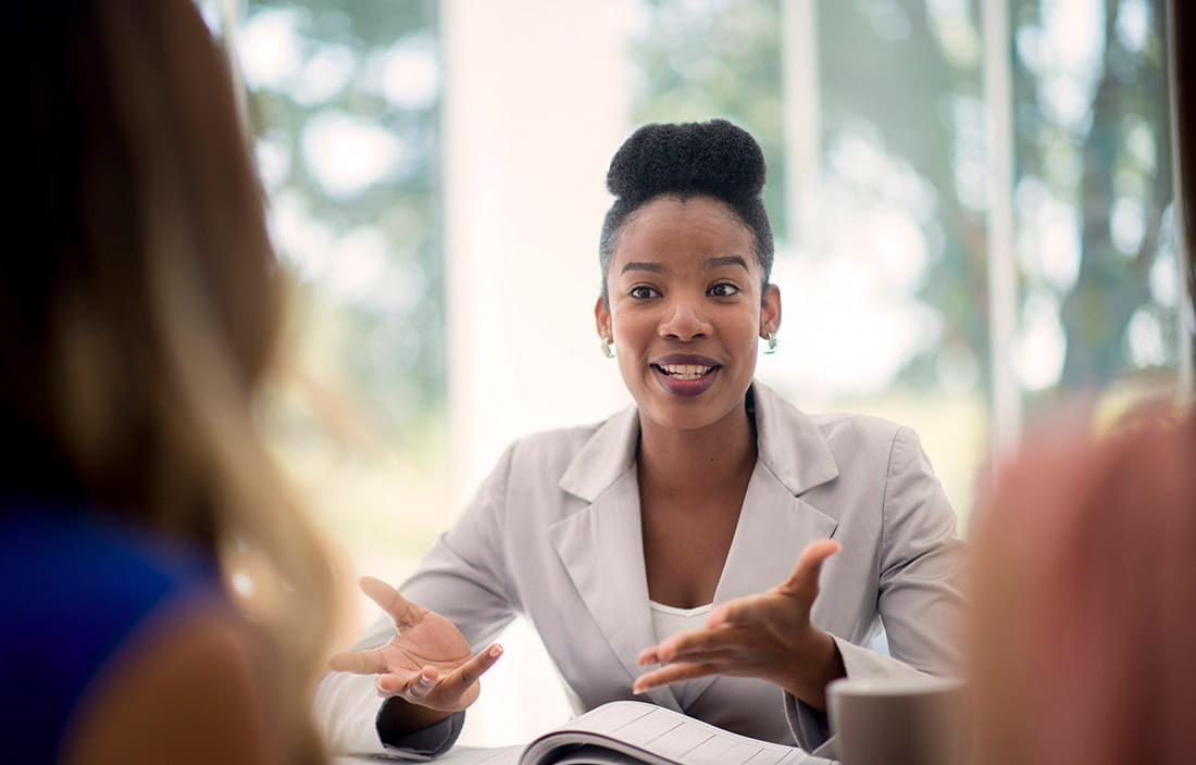 Woman discussing interal controls and financial controls with colleagues 