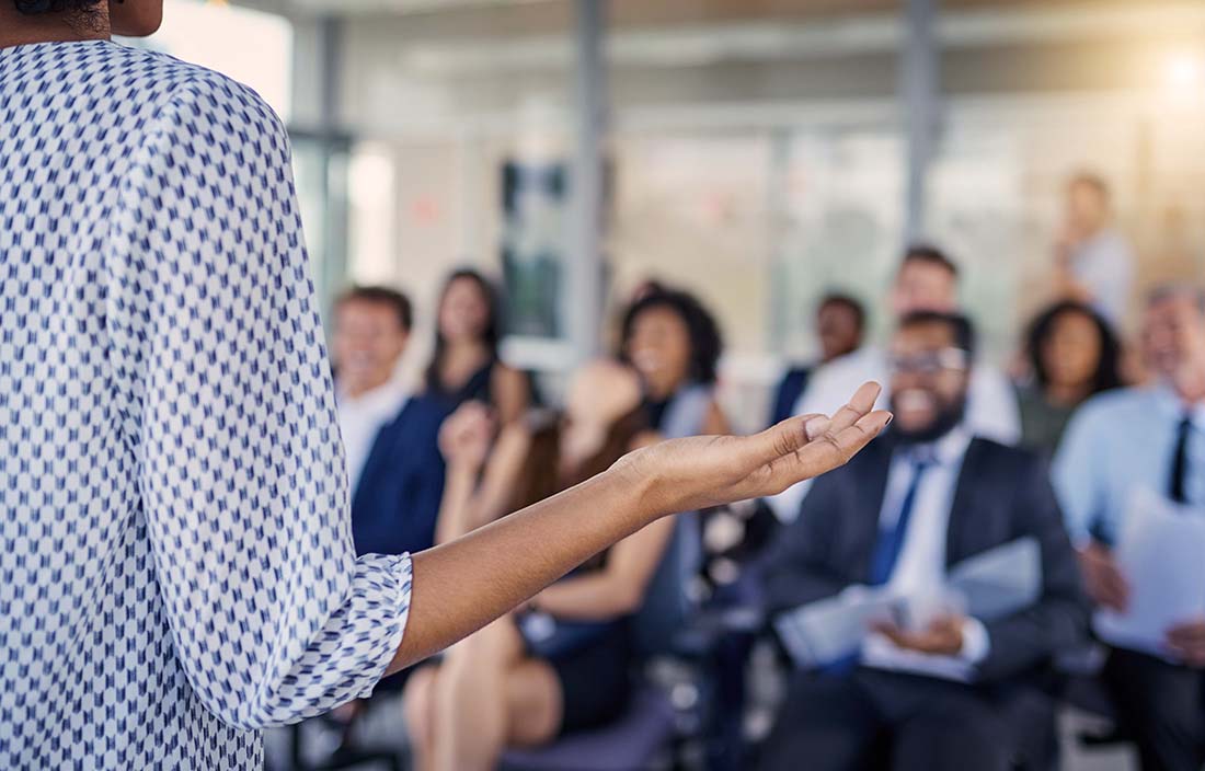 Image of women presenting to large group