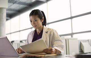 Nurse doing charts