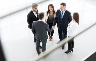 Business people meeting in hallway