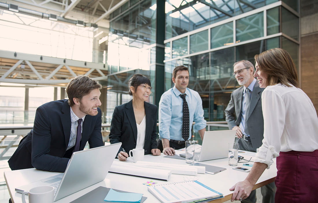 Business professionals gathered around a table