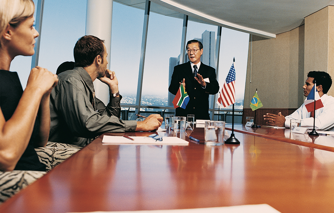 International meeting with country flags on conference room table