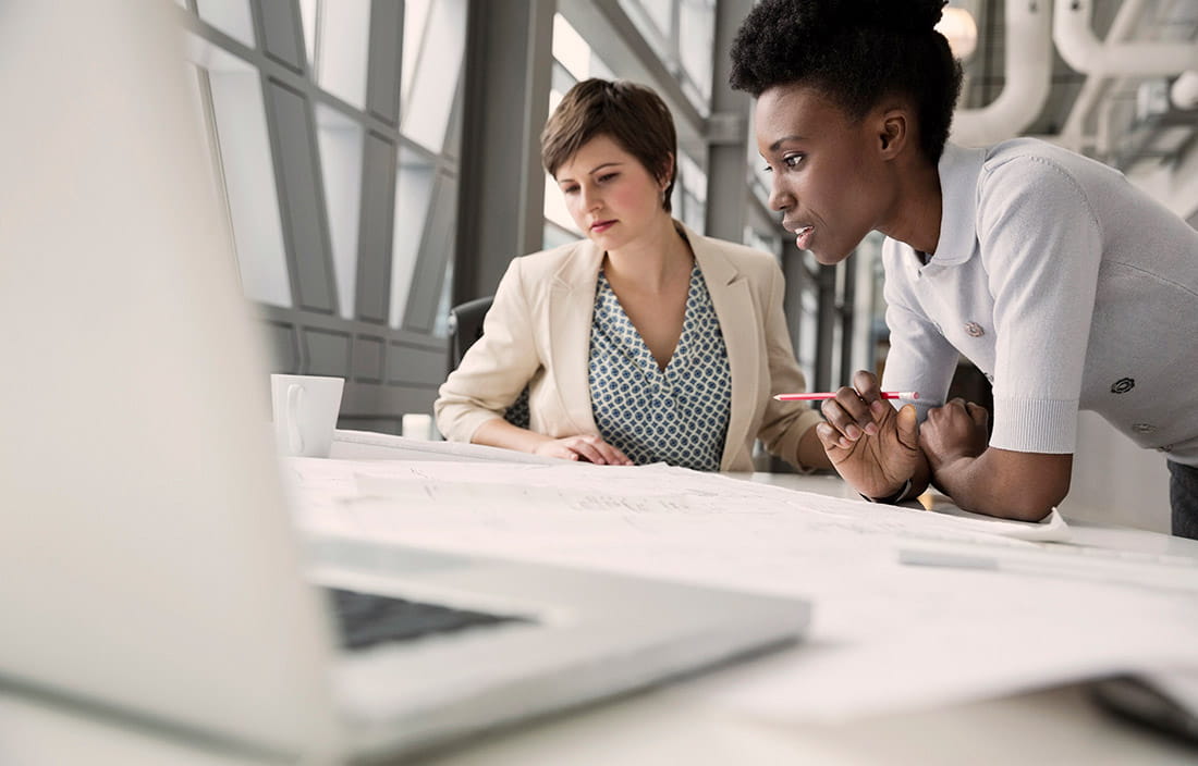 Professionals working at a desk
