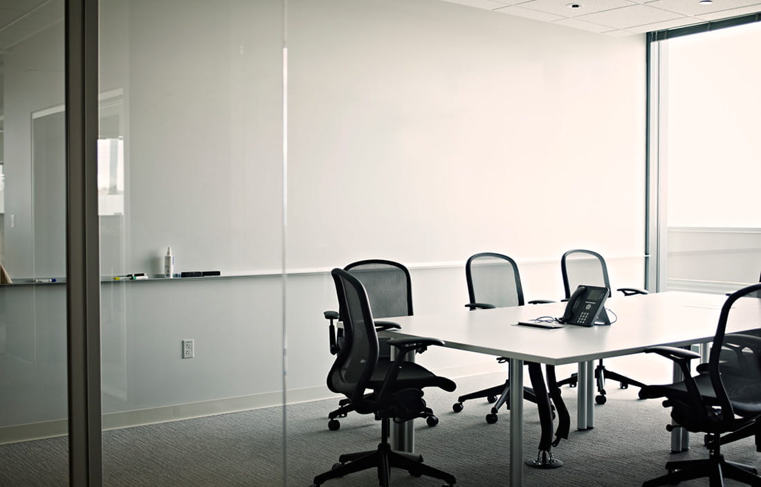 Empty meeting room with a table and chairs