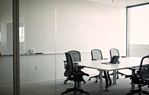 Empty meeting room with a table and chairs