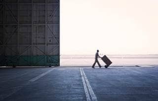 man walking with dolly