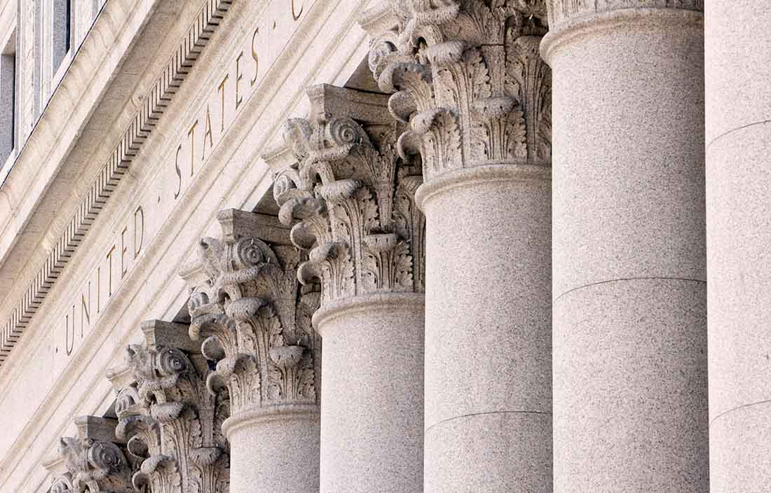 Close-up photo of columns on an older government building.
