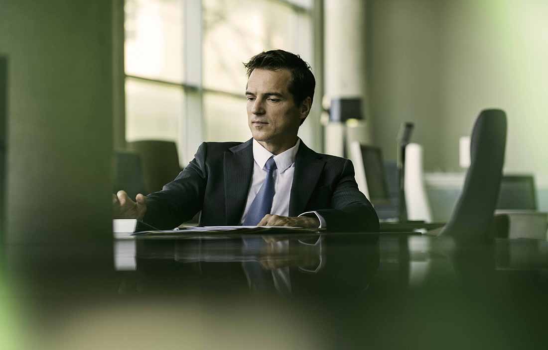 Businessman sitting at a desk.