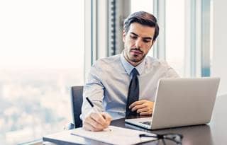 Professional alone at computer