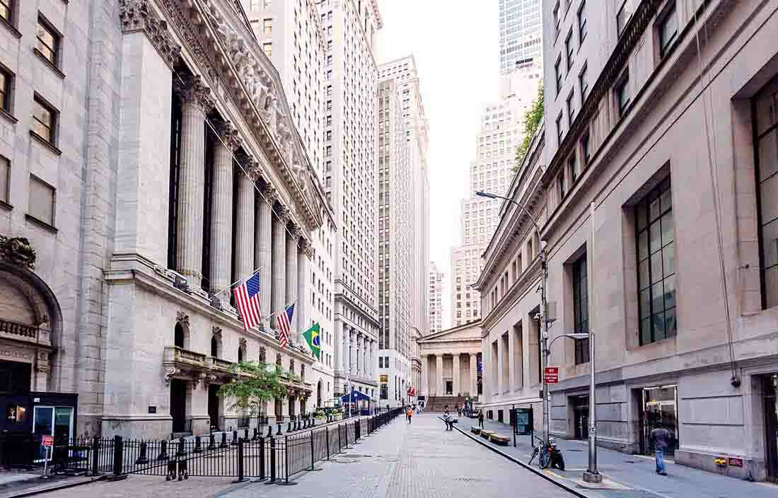 Outside on an empty street in the middle of a city