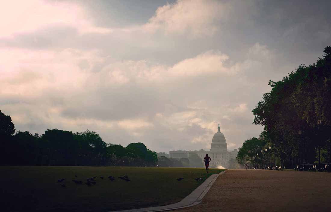 A man running outside the White House. 