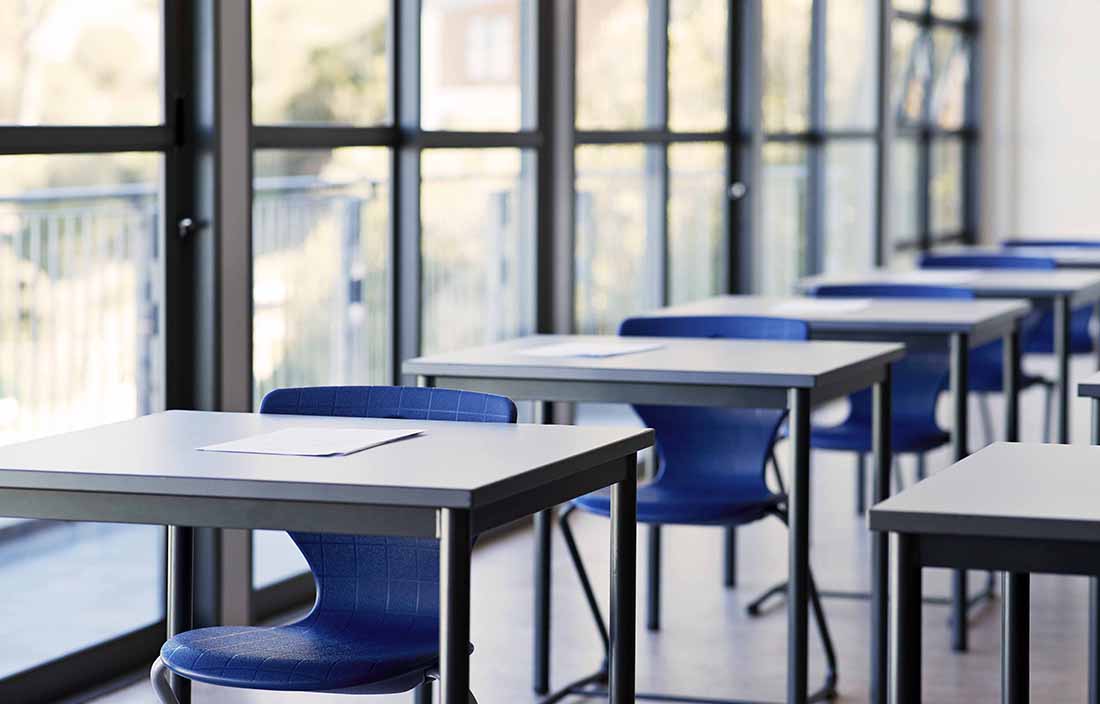 Empty desks in a classroom