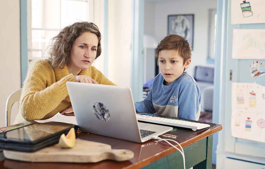 Mother and son looking at a laptop