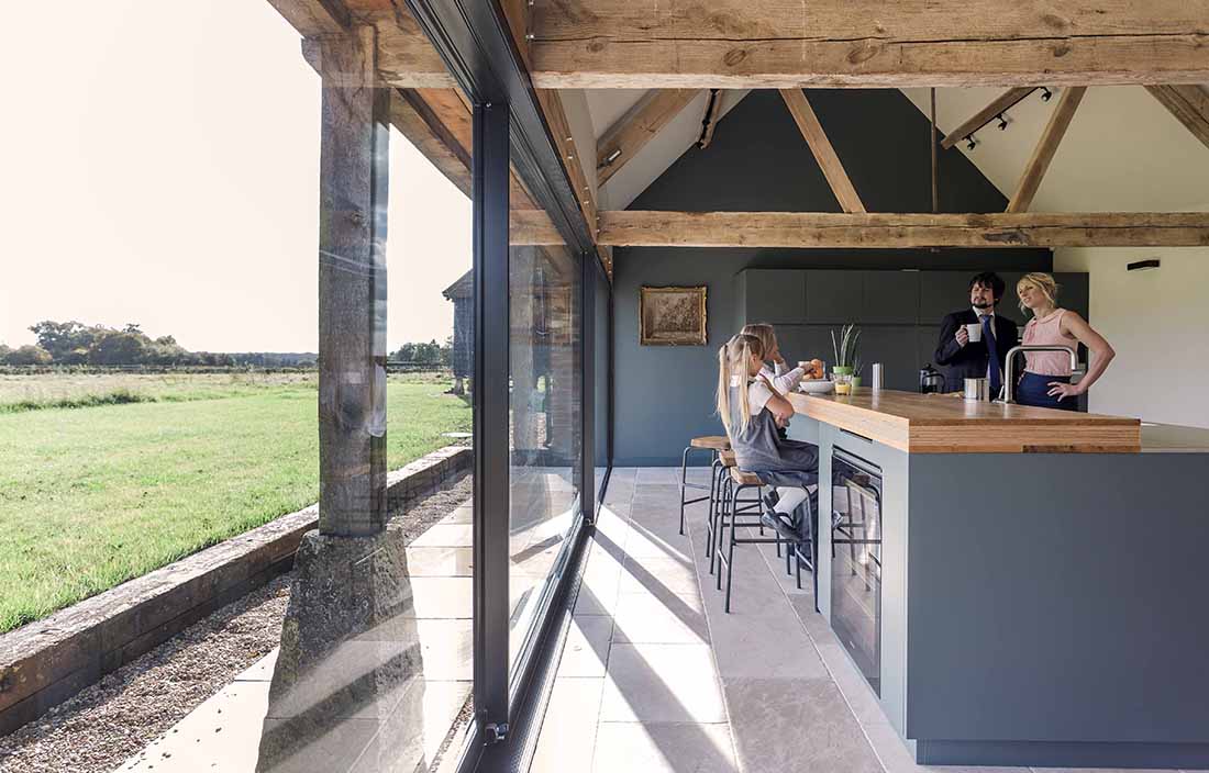 Family having breakfast in a high-end kitchen.